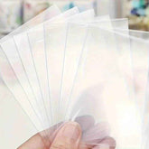 🛡️ Keep Those Precious Cards Safe: 100pcs Transparent Durable Card Sleeves for Boys Who Love Their Collections - ThiGui