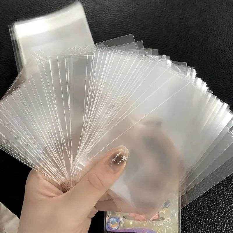 🛡️ Keep Those Precious Cards Safe: 100pcs Transparent Durable Card Sleeves for Boys Who Love Their Collections - ThiGui